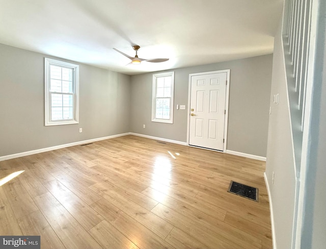 entryway with light hardwood / wood-style floors and ceiling fan