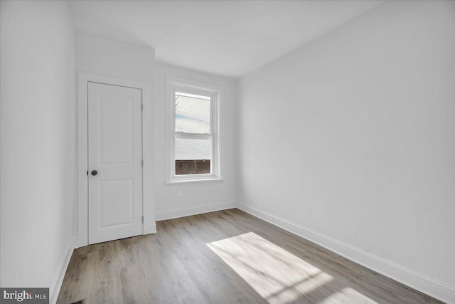 unfurnished room featuring light hardwood / wood-style floors