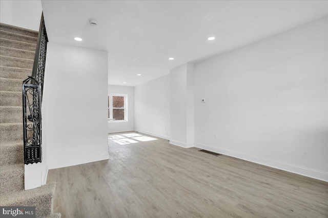 unfurnished living room with light hardwood / wood-style flooring