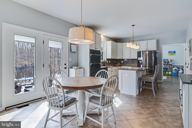 dining room featuring sink