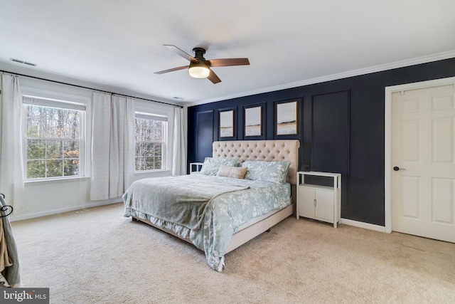 bedroom featuring crown molding, carpet floors, and ceiling fan