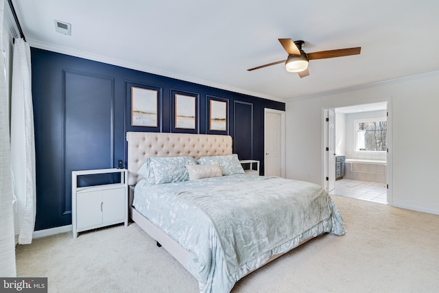 bedroom featuring crown molding, carpet, connected bathroom, and ceiling fan