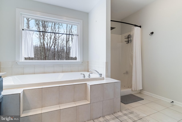 bathroom featuring plus walk in shower and tile patterned floors