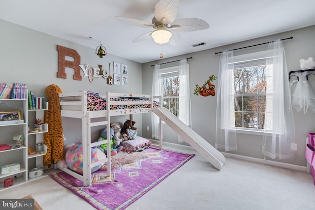 carpeted bedroom with ceiling fan