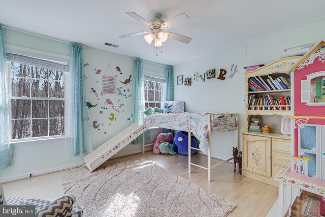 bedroom with hardwood / wood-style flooring and ceiling fan