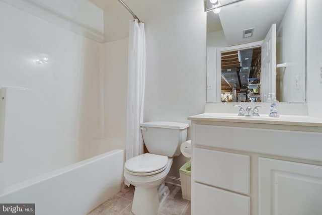 full bathroom featuring toilet, vanity, tile patterned floors, and shower / bath combo with shower curtain