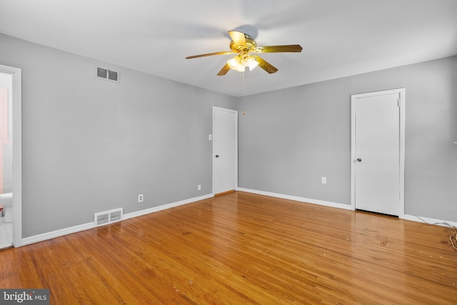 spare room featuring light hardwood / wood-style floors and ceiling fan