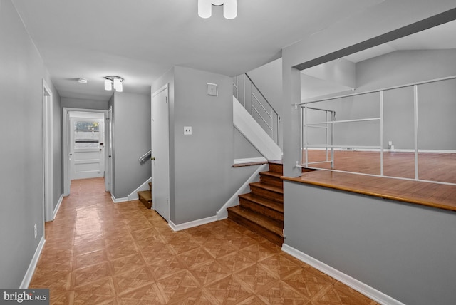 stairway with lofted ceiling