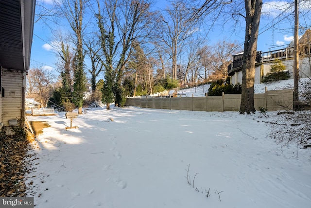 view of yard layered in snow