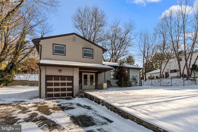 front facade with french doors and a garage