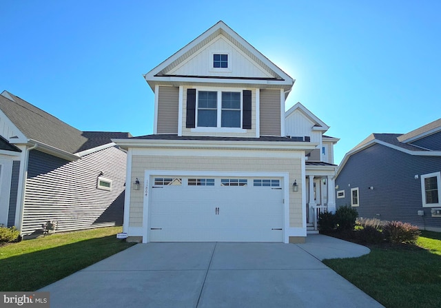 view of front of house with a front yard and a garage