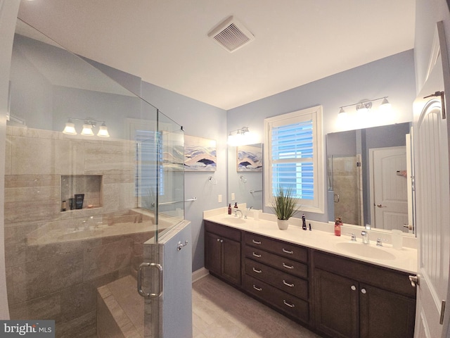 bathroom with walk in shower and vanity