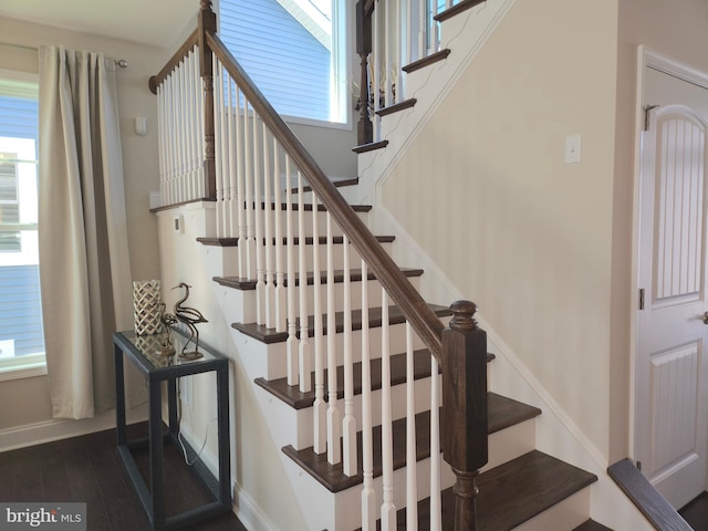 staircase with hardwood / wood-style flooring