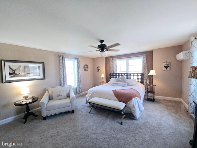 bedroom featuring ceiling fan, carpet flooring, and a wall mounted air conditioner