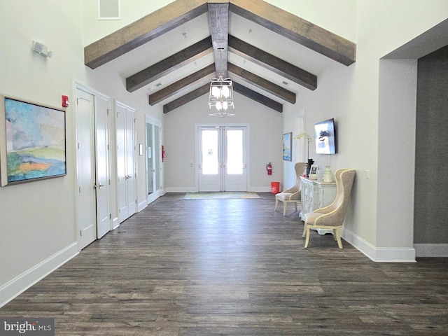 foyer featuring dark wood-type flooring, french doors, and vaulted ceiling with beams