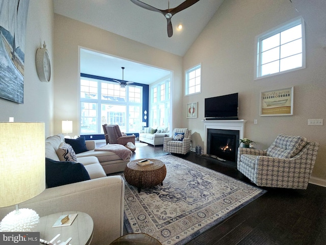 living room with ceiling fan, high vaulted ceiling, hardwood / wood-style floors, and plenty of natural light