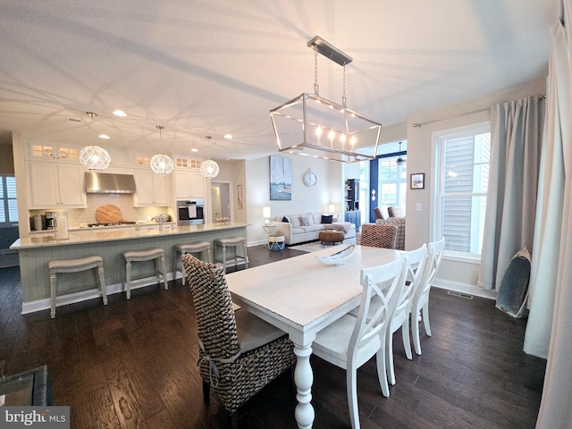 dining area featuring dark hardwood / wood-style floors