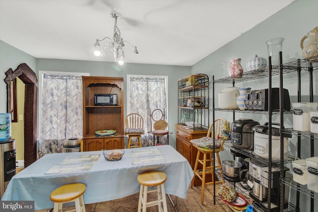 dining space featuring a notable chandelier