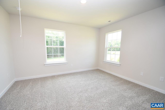 empty room with carpet flooring