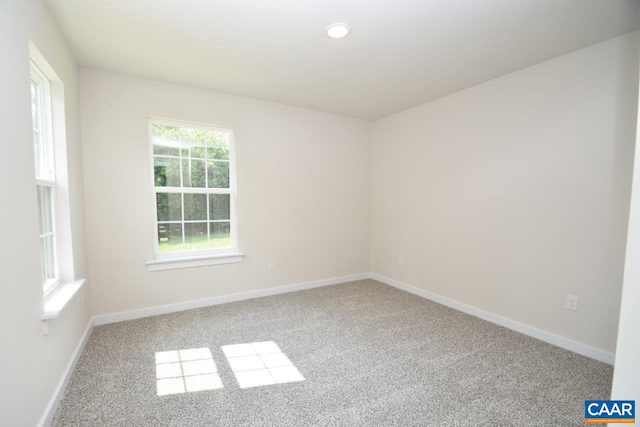 empty room featuring light carpet