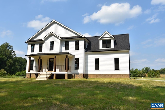 view of front of home with covered porch and a front yard