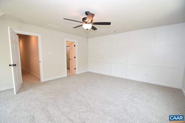 unfurnished bedroom featuring light carpet and ceiling fan