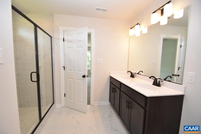 bathroom featuring vanity and a shower with door