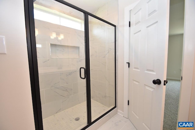 bathroom featuring an enclosed shower