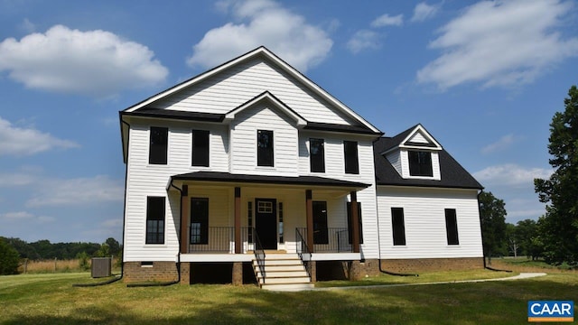 view of front of house with a front yard and a porch