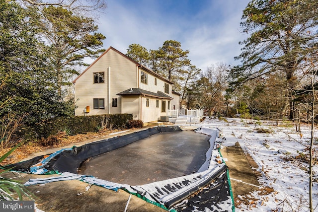 view of snow covered house