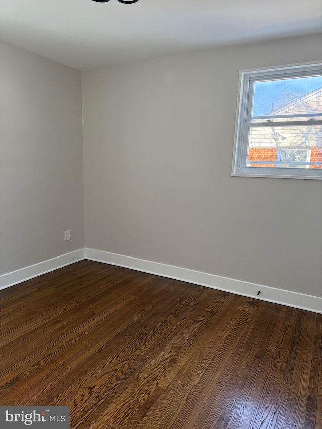 empty room featuring dark hardwood / wood-style floors