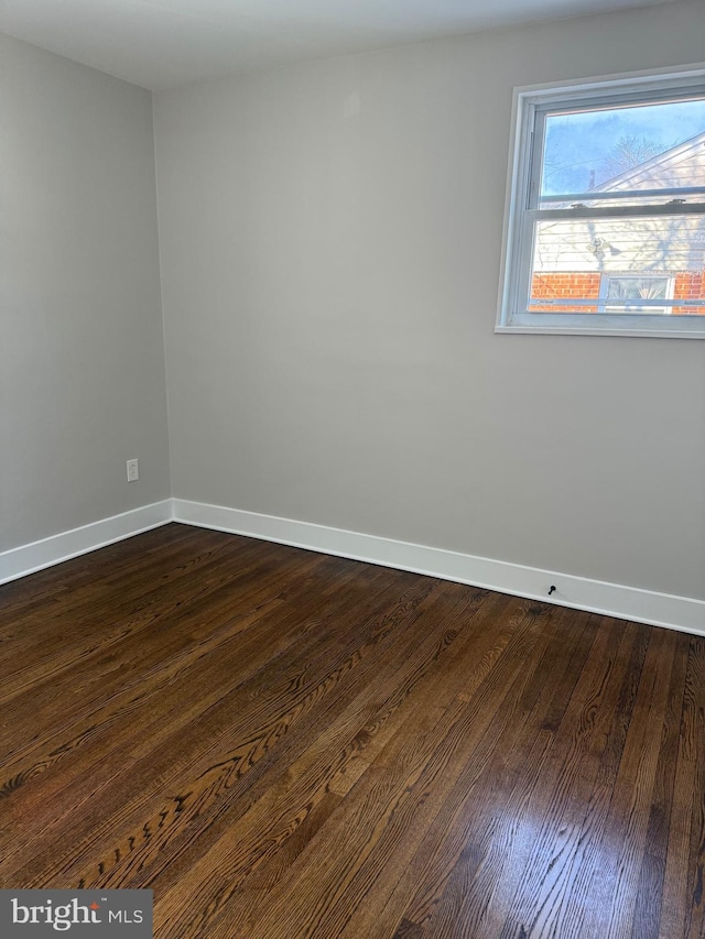 empty room featuring dark hardwood / wood-style floors