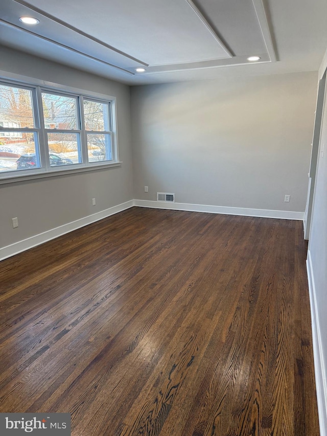 unfurnished room featuring dark hardwood / wood-style floors