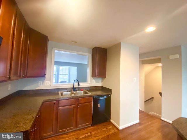 kitchen with sink, hardwood / wood-style flooring, and dishwasher