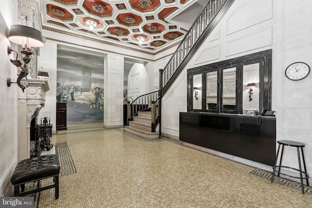 foyer featuring ornamental molding