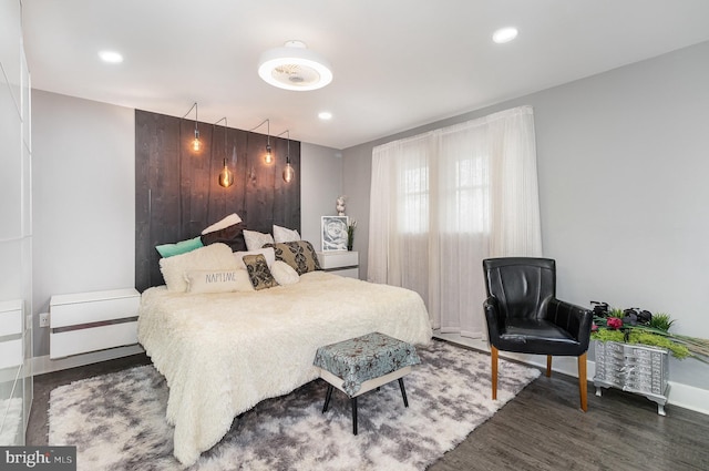 bedroom featuring baseboards, dark wood-type flooring, and recessed lighting