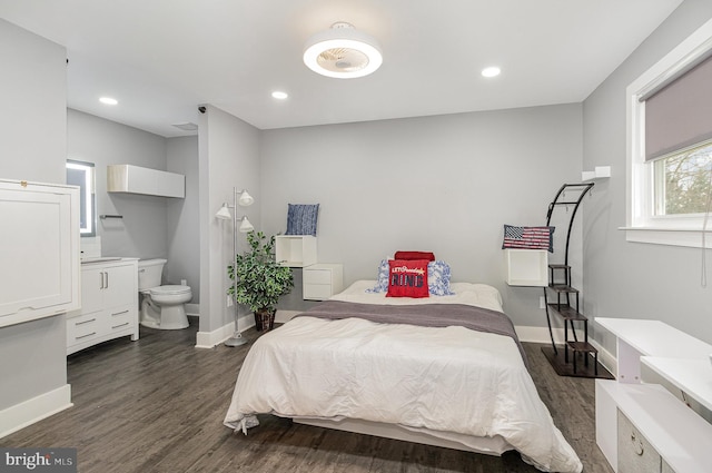 bedroom with recessed lighting, dark wood finished floors, and baseboards