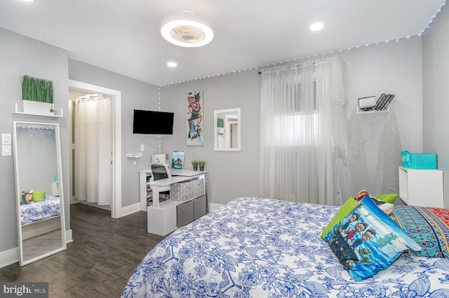 bedroom featuring dark wood-type flooring, recessed lighting, and baseboards