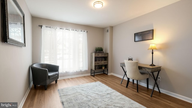 office space with hardwood / wood-style flooring