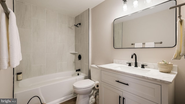 full bathroom with tiled shower / bath combo, toilet, and vanity