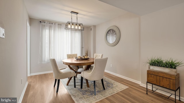 dining area featuring wood-type flooring