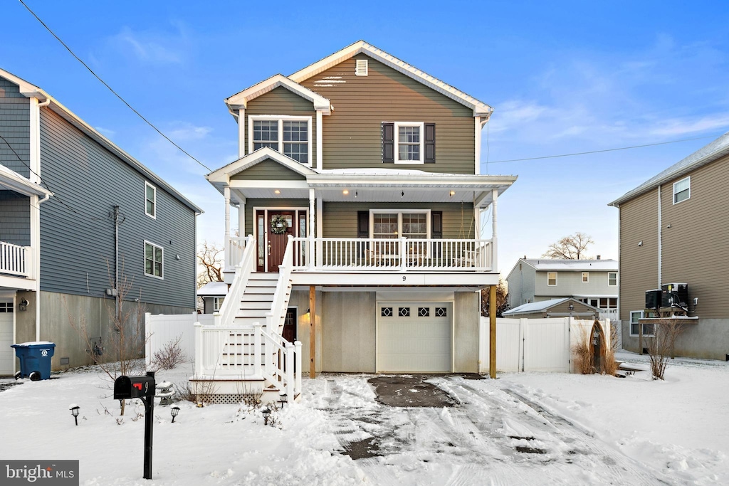 view of front of house featuring a garage and covered porch