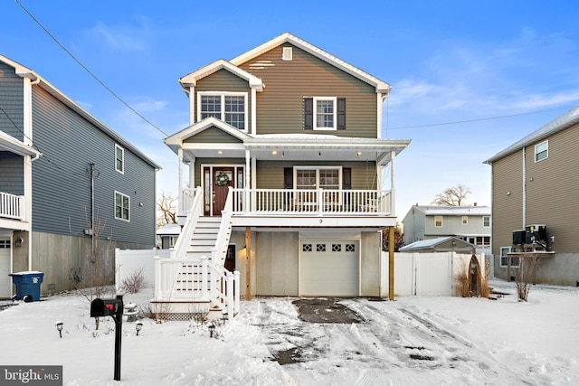 view of front of house featuring a garage and covered porch