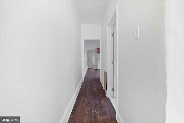 hall featuring dark wood-type flooring