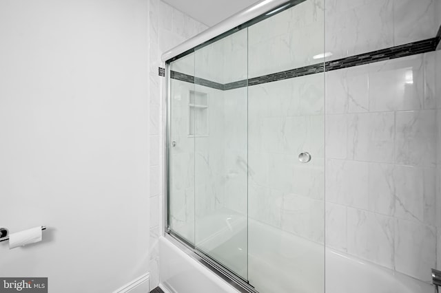 full bath with shower / bath combination with glass door