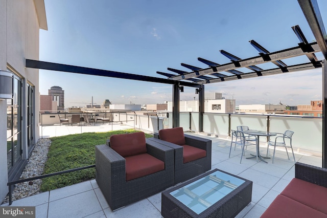 view of patio / terrace with an outdoor living space and a pergola