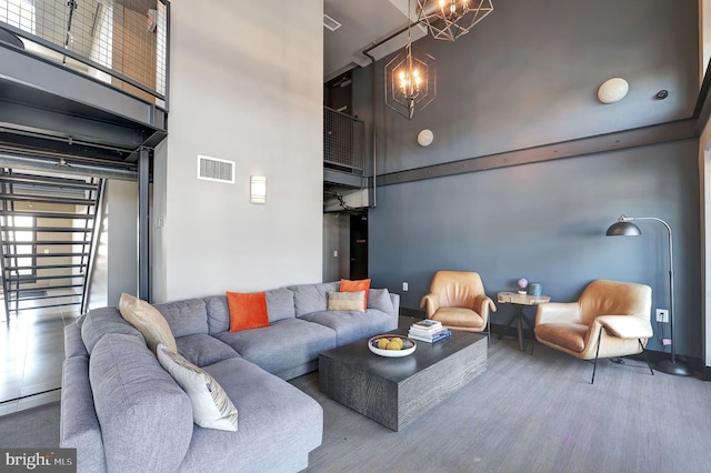 living room with a high ceiling and a chandelier