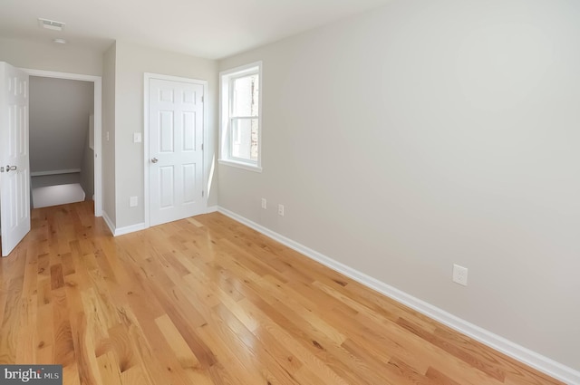 unfurnished bedroom with light hardwood / wood-style floors