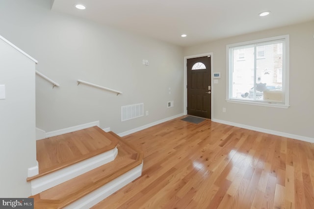 entryway with hardwood / wood-style flooring