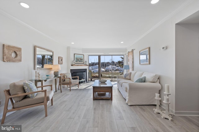 living room featuring crown molding and light hardwood / wood-style floors